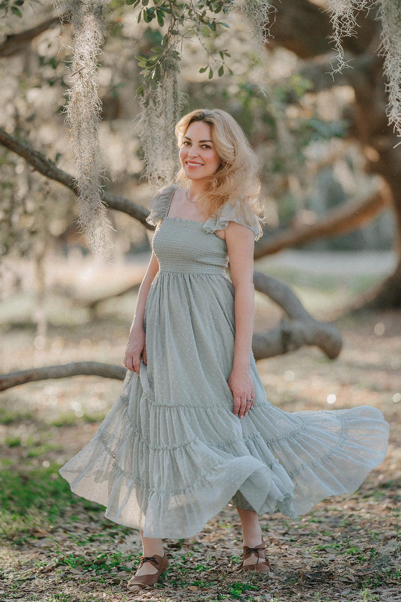 Full-length view of the Bay Leaf Swiss dot maxi dress featuring a smocked bodice and flowing tiered skirt.
