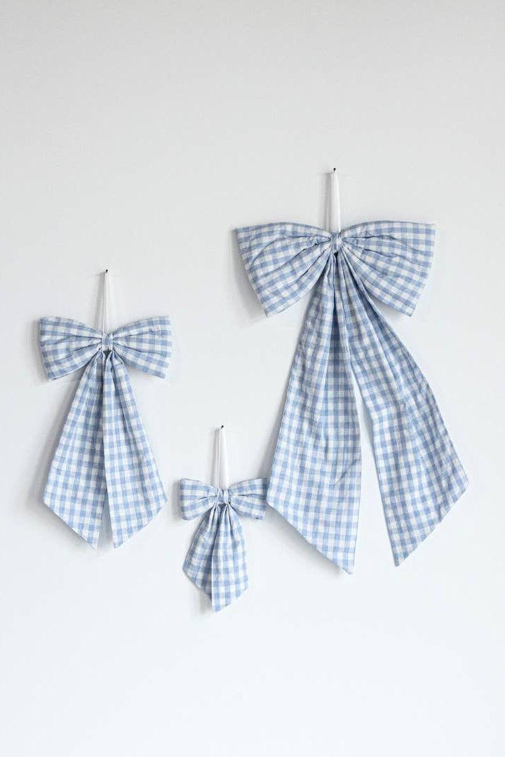 Baby blue gingham heirloom fabric bows in small, medium, and large sizes for nursery and home decor.