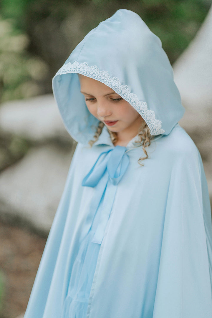 Close view of The Cendrillon pale blue satin hood with delicate white lace trim and coordinating satin ribbon tie