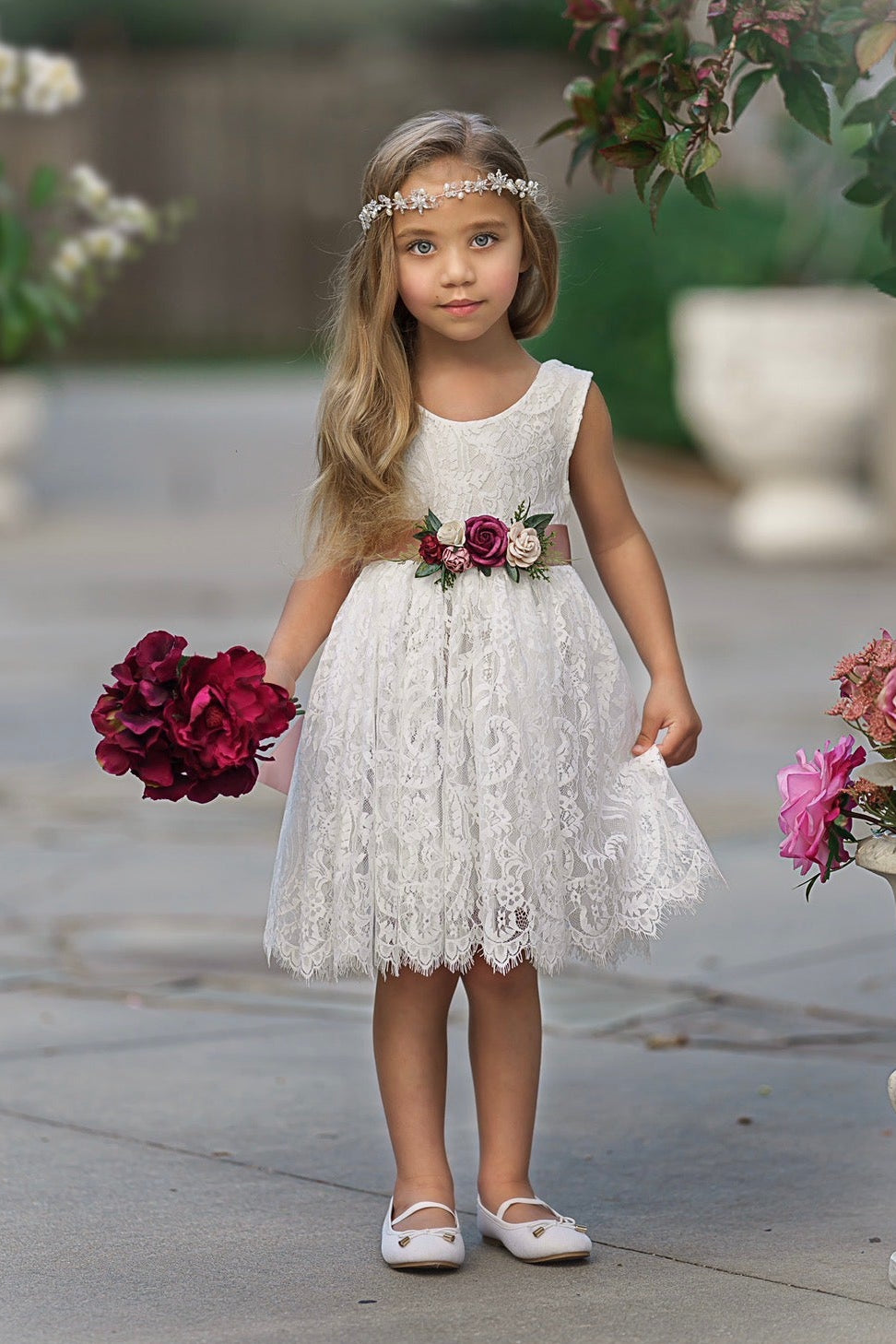 Soft white lace flower girl dress front view with knee-length scalloped eyelash lace hem