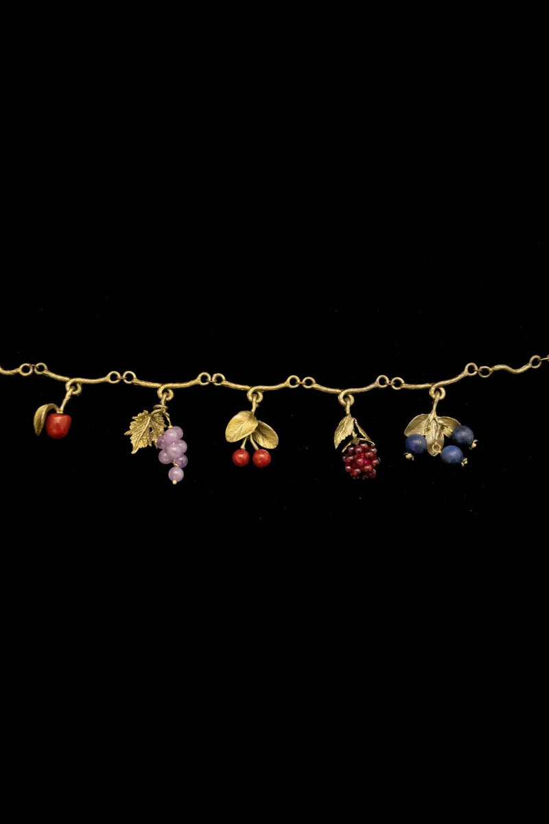 Michael Michaud Fruit Charm Bracelet full view with botanical fruit charms including red glass apple, amethyst grapes, red jade cherries, garnet raspberry, and lapis blueberry