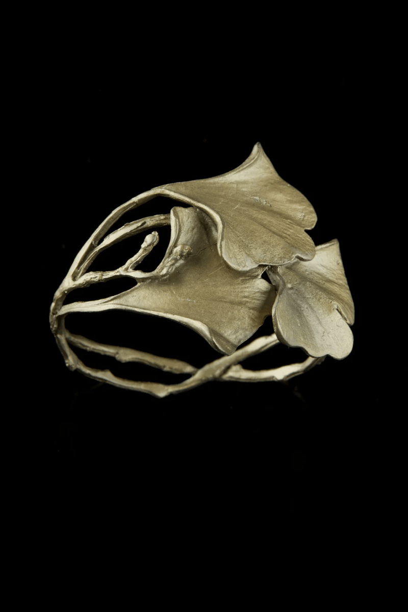 Ginkgo cuff bracelet featuring sculptural ginkgo leaves cast in hand-patinated bronze with botanical detailing