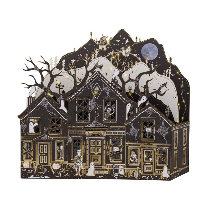 Detailed haunted paper house featuring ghosts, skeletons, pumpkins, cobwebs, and gold foil accents.