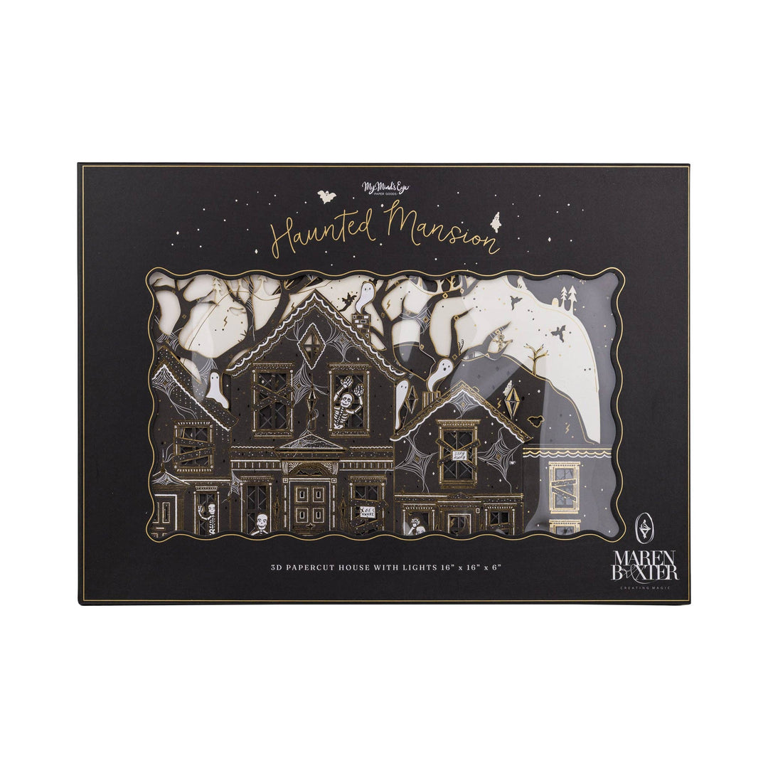 Close-up of the haunted paper house showing intricate paper-cut details, tiny ghosts, skeletons, and glowing windows.