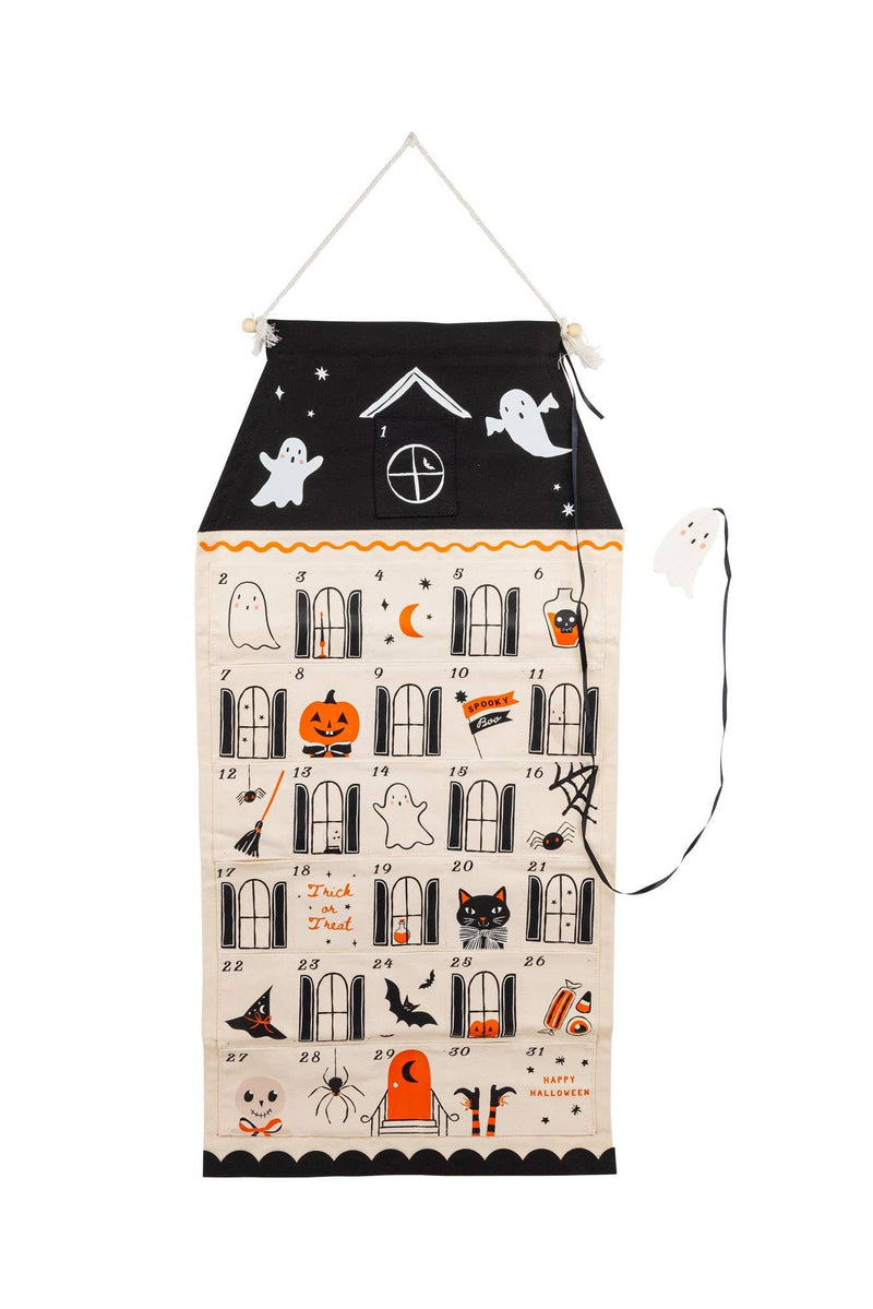 A hanging Halloween advent calendar with a black roof and numbered windows on a cream background, decorated with spooky illustrations like ghosts, pumpkins, bats, and spiders.