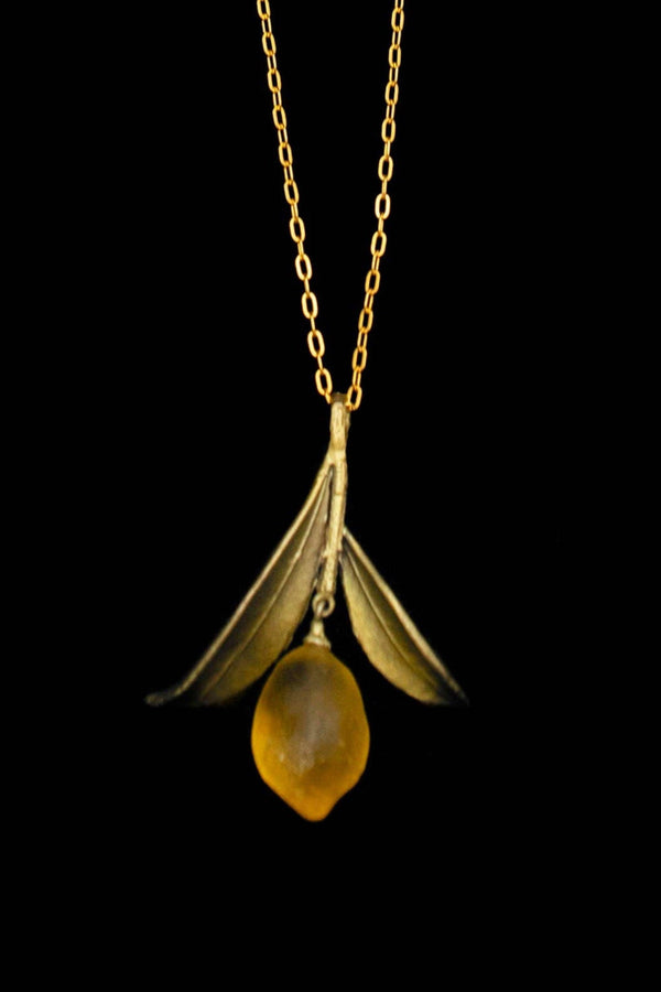 Michael Michaud Lemon Drop pendant necklace featuring a hand-patinated bronze leaf and cast glass lemon charm with freshwater pearl accents.
