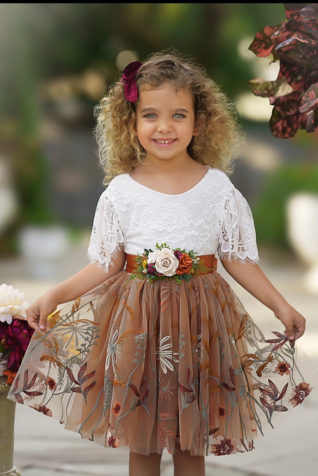 Marigold knee length flower girl dress with white lace bodice and burnt orange floral embroidered tulle skirt
