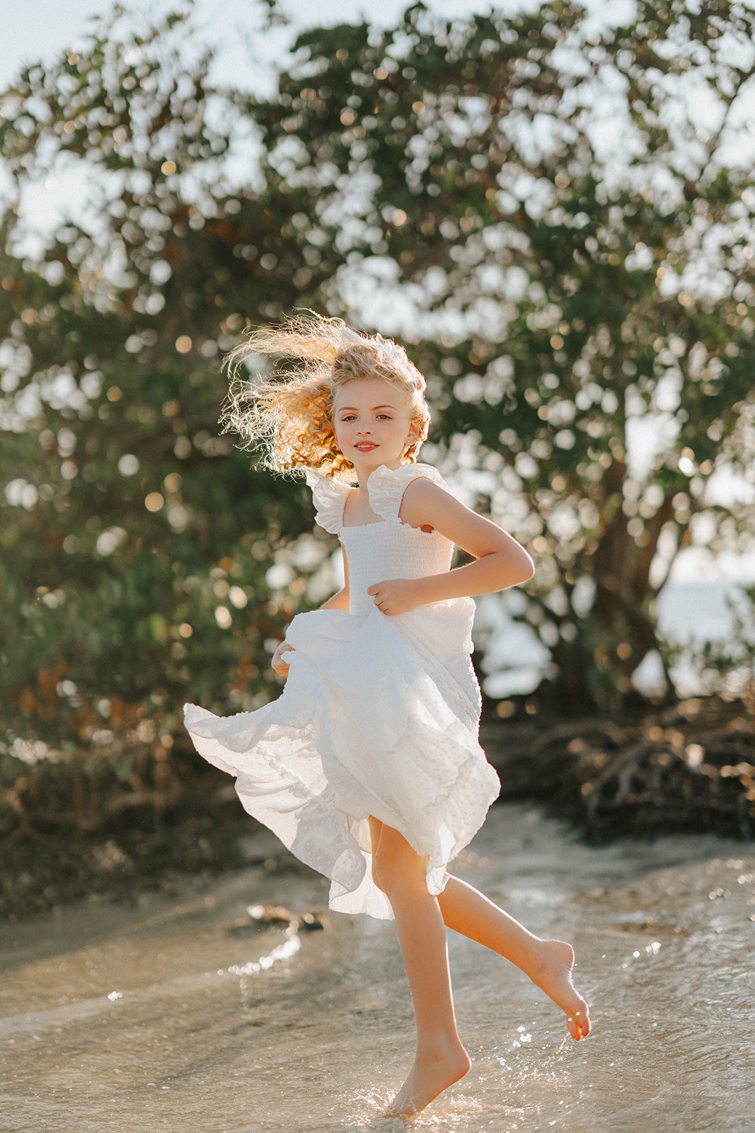 Orange Blossom Orchard Collection dress photographed during a summer waterside lifestyle session.