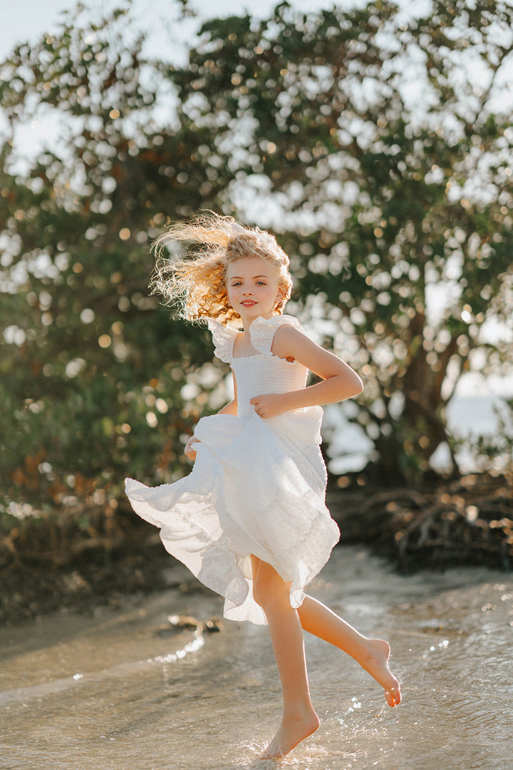 Orange Blossom Orchard Collection dress photographed during a summer waterside lifestyle session.