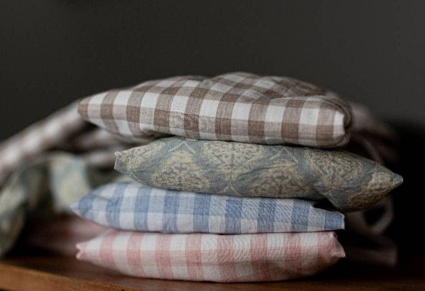 Pink gingham heirloom fabric bows in small, medium, and large sizes for nursery decor.