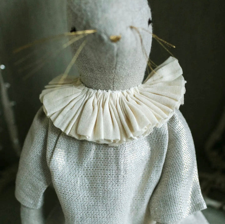 Close-up of the hand-pleated ruffle collar on a handcrafted bunny heirloom art doll