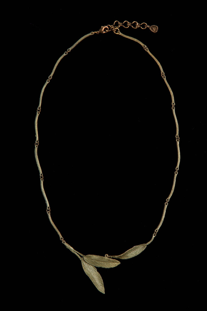 Michael Michaud Strawberry Pendant Necklace featuring a flame-worked red glass berry on an adjustable bronze chain