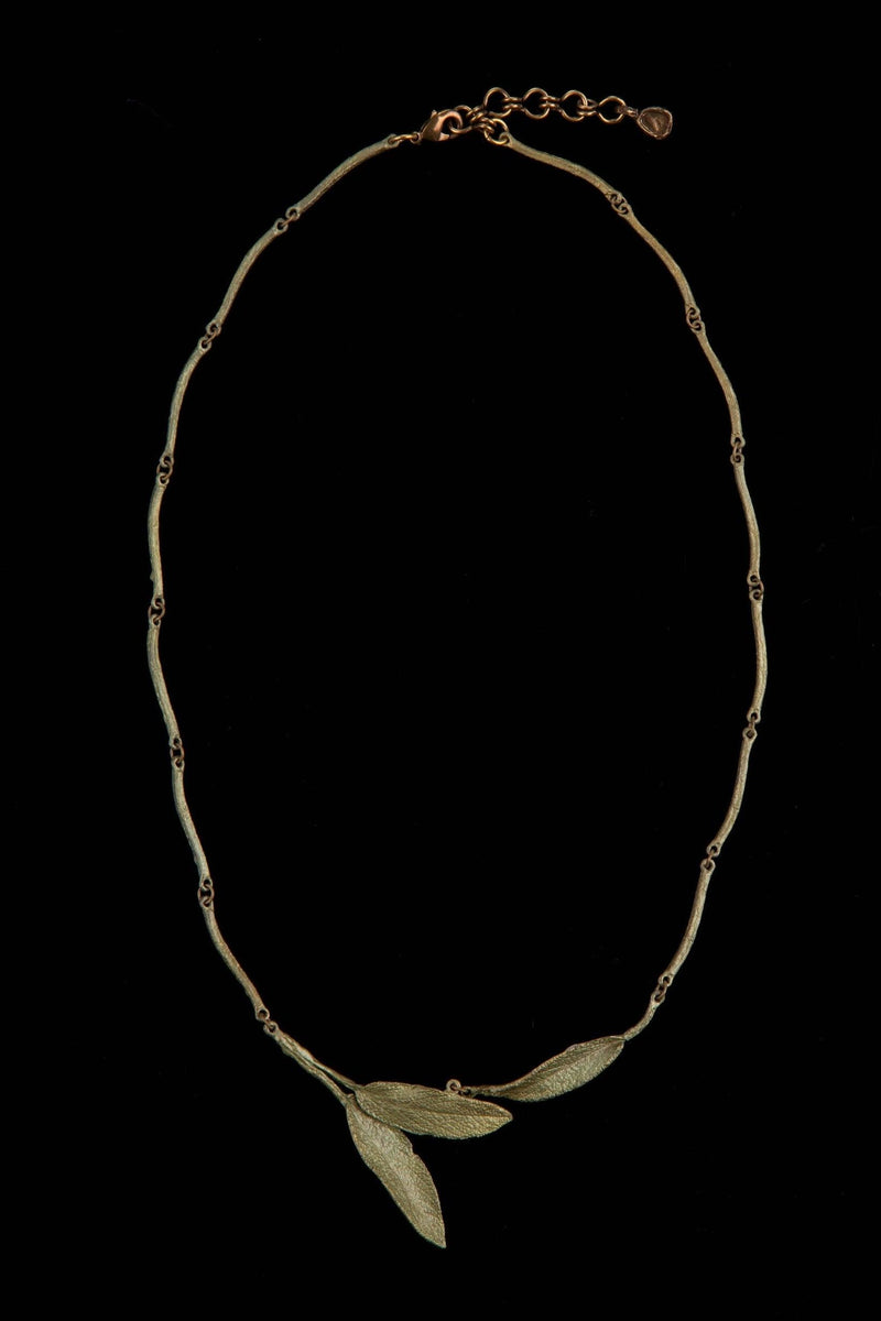 Michael Michaud Strawberry Pendant Necklace featuring a flame-worked red glass berry on an adjustable bronze chain