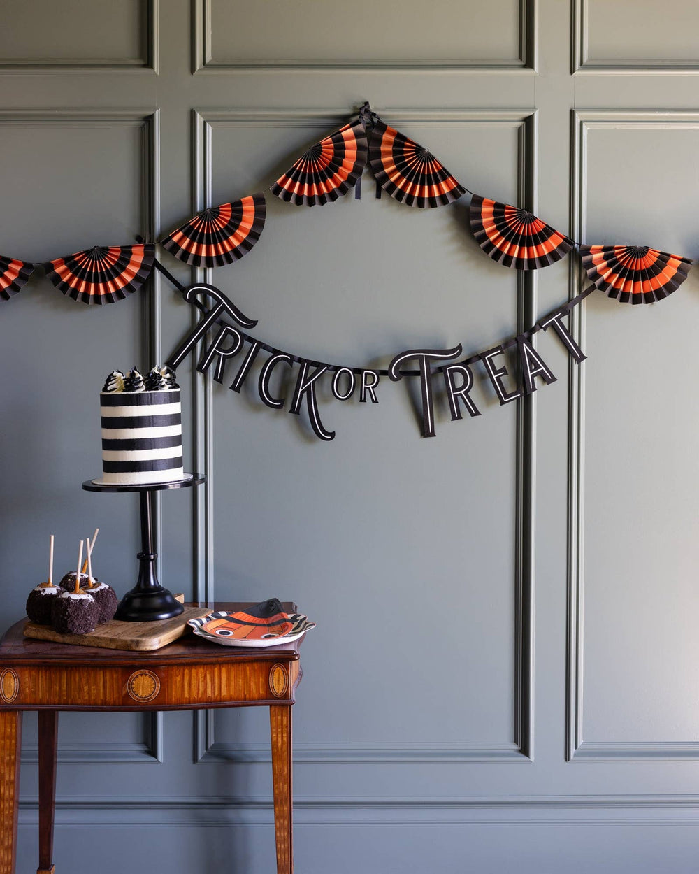 Black Trick or Treat felt banner styled on a front door for Halloween trick-or-treat night