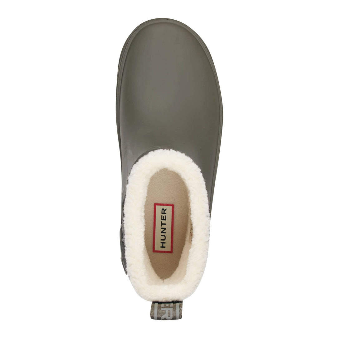 Insulated Willa Hunter slip-on rain boot shown from a top-down view, featuring a matte dark gray rubber exterior, a plush white faux-fur collar, and a tan interior with a visible Hunter brand label.
