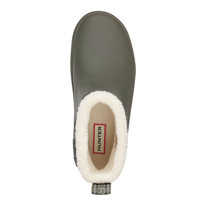 Insulated Willa Hunter slip-on rain boot shown from a top-down view, featuring a matte dark gray rubber exterior, a plush white faux-fur collar, and a tan interior with a visible Hunter brand label.